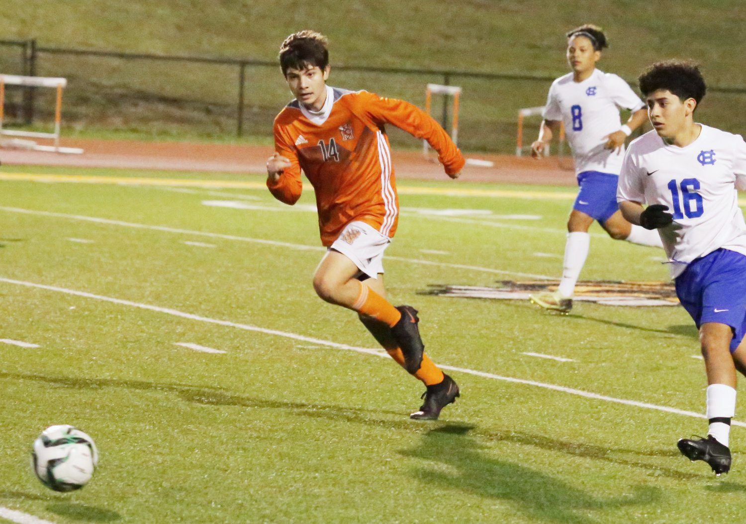 Mineola defender Royer Marquez accelerates to the ball in early action against Chapel Hill.